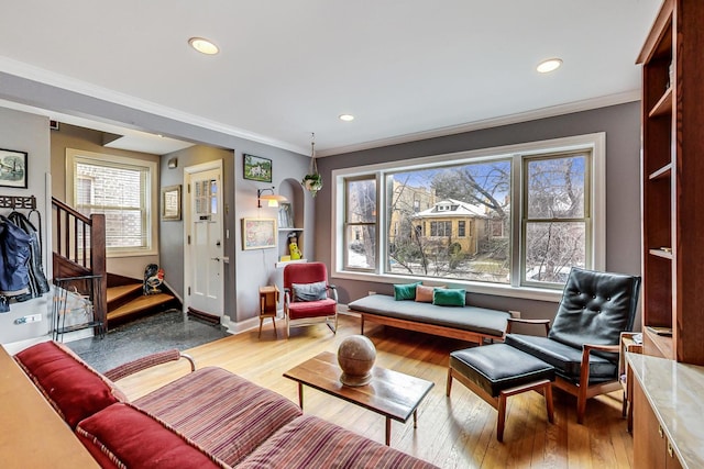 sitting room with crown molding, recessed lighting, hardwood / wood-style flooring, and a wealth of natural light