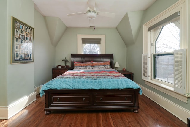 bedroom featuring ceiling fan, lofted ceiling, and dark hardwood / wood-style flooring