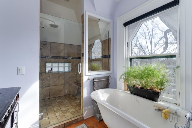 bathroom with separate shower and tub