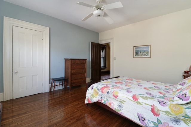 bedroom featuring dark hardwood / wood-style floors and ceiling fan