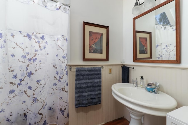 bathroom with sink and walk in shower