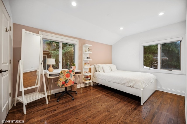 bedroom featuring lofted ceiling and dark hardwood / wood-style flooring