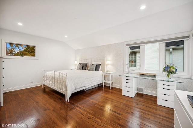 bedroom featuring lofted ceiling and dark hardwood / wood-style flooring