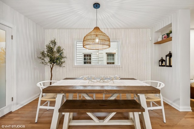 dining space featuring light wood-type flooring