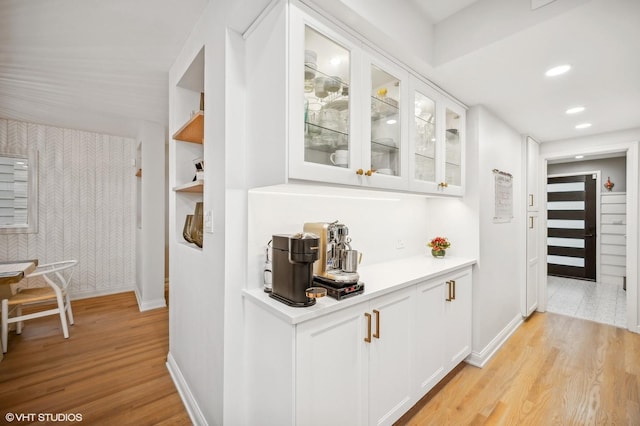 corridor featuring light hardwood / wood-style floors