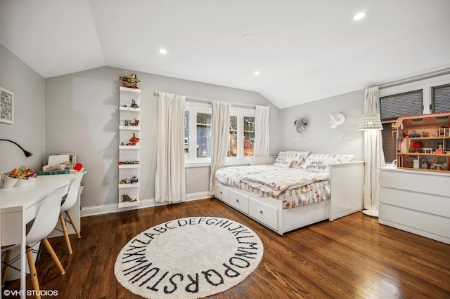 bedroom featuring lofted ceiling and dark hardwood / wood-style flooring