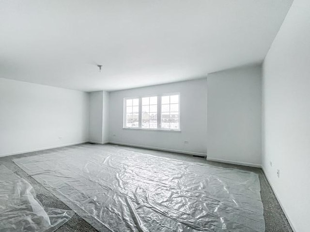 empty room featuring carpet flooring