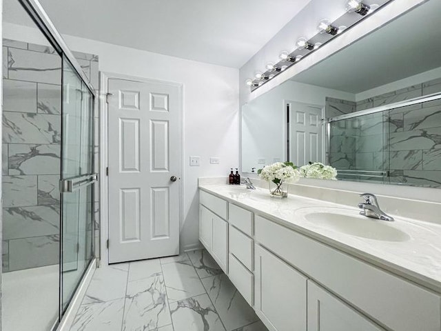 bathroom with a shower with door and vanity