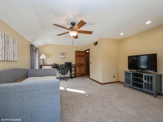 carpeted living room featuring ceiling fan and lofted ceiling