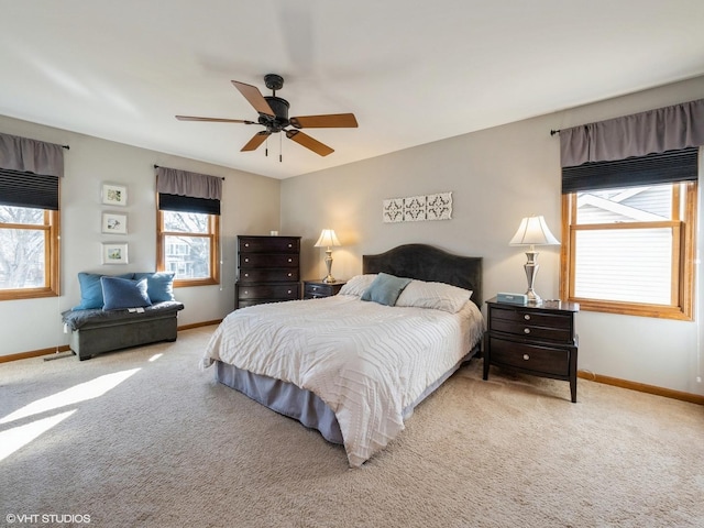 bedroom with light colored carpet and ceiling fan