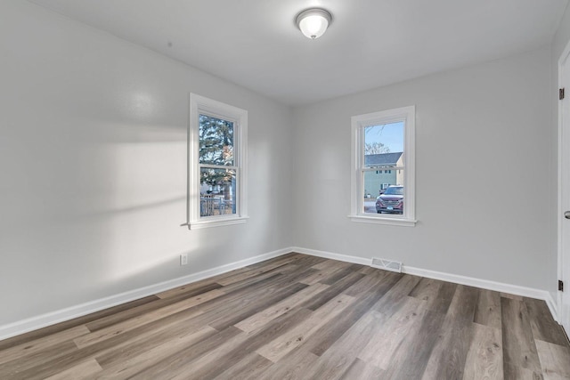 empty room featuring hardwood / wood-style floors