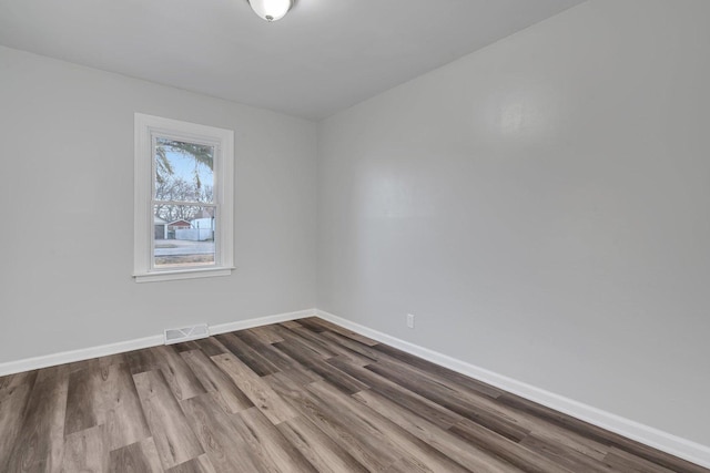 spare room featuring hardwood / wood-style floors