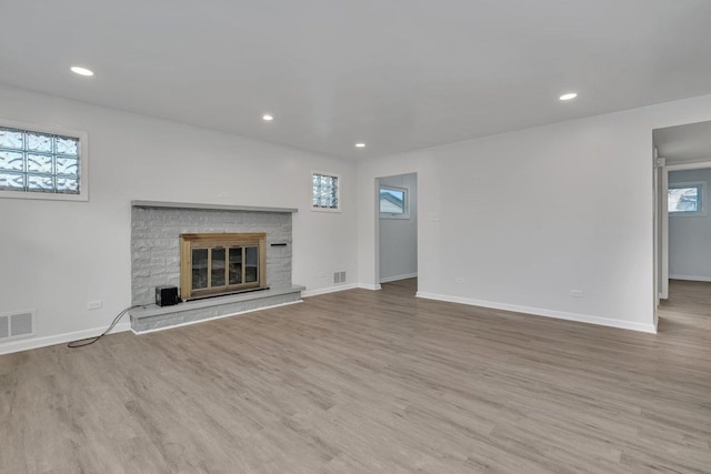 unfurnished living room with light hardwood / wood-style floors