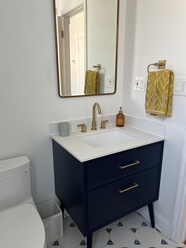 bathroom featuring vanity and toilet