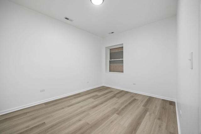 unfurnished room featuring light wood-type flooring