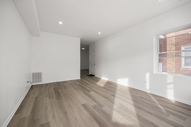 spare room featuring light wood-type flooring