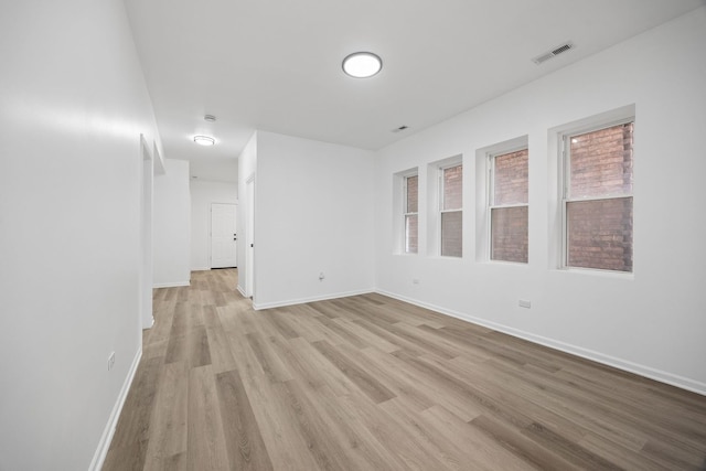 spare room featuring light hardwood / wood-style floors