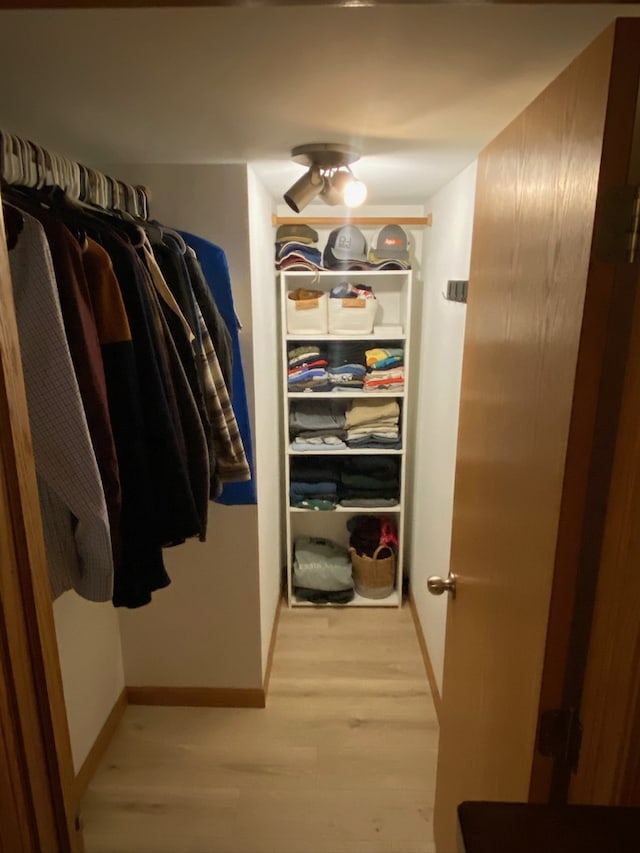 spacious closet featuring light hardwood / wood-style floors