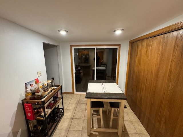 interior space featuring light tile patterned floors