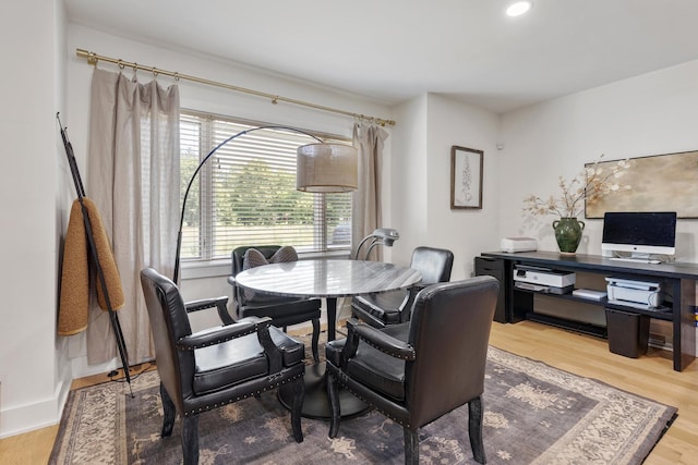 dining area with hardwood / wood-style flooring