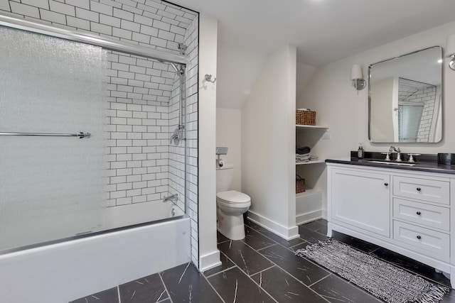 full bathroom with vanity, toilet, and combined bath / shower with glass door