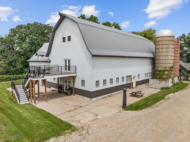 exterior space with french doors, a yard, and a deck