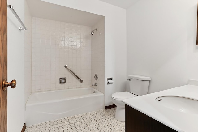 full bathroom with vanity, toilet, and tiled shower / bath combo