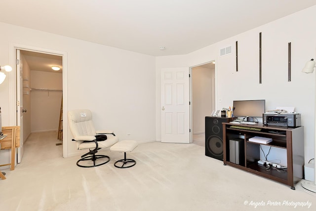 living area with light colored carpet