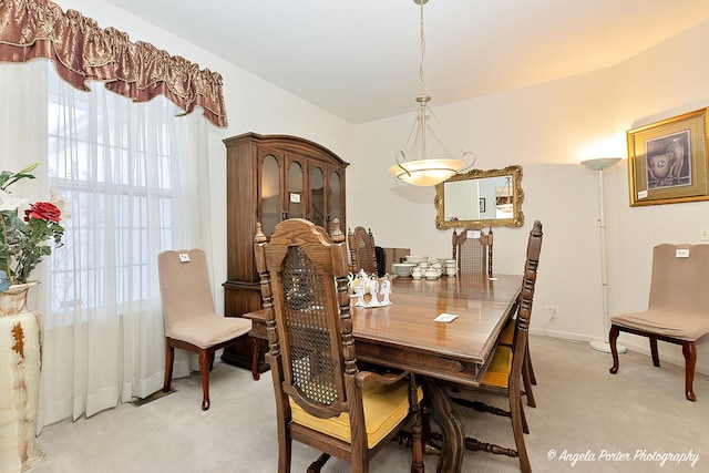 view of carpeted dining space