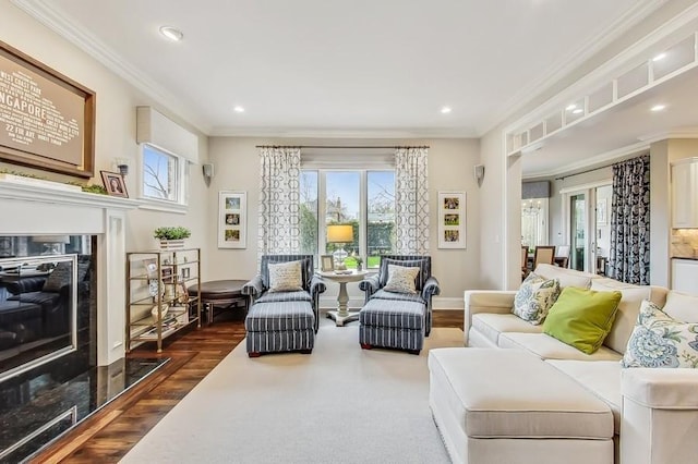 living room featuring dark hardwood / wood-style flooring, a fireplace, ornamental molding, and french doors