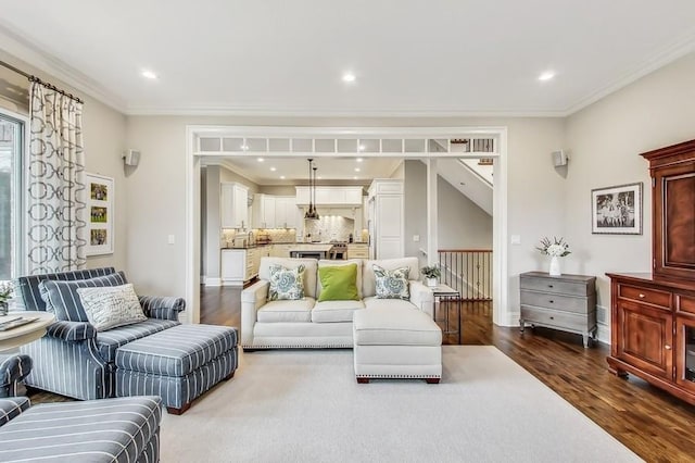 living room featuring crown molding and hardwood / wood-style floors