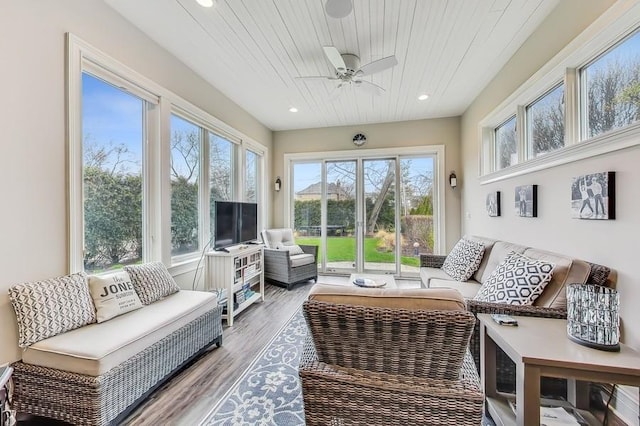 sunroom featuring wooden ceiling and ceiling fan