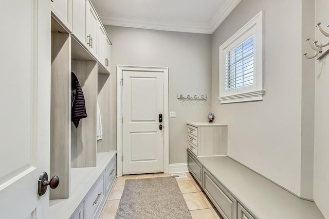 mudroom featuring light tile patterned floors and ornamental molding