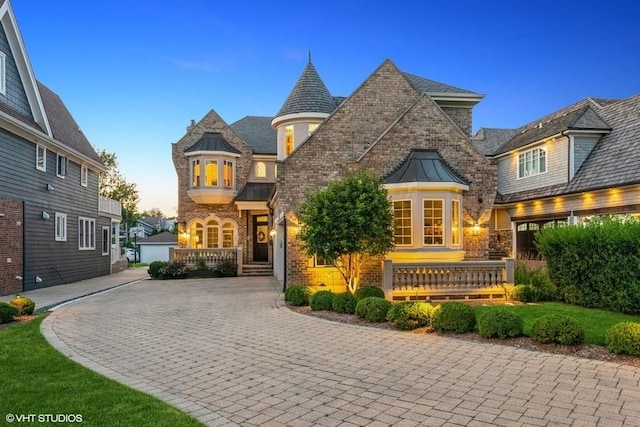 view of front of property featuring a garage and an outdoor structure