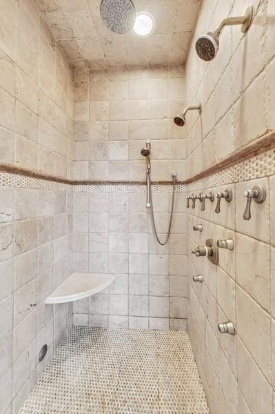 bathroom with tiled shower