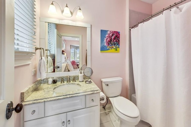 bathroom with vanity, walk in shower, and toilet