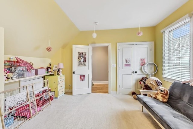 game room with vaulted ceiling, carpet, and a wealth of natural light