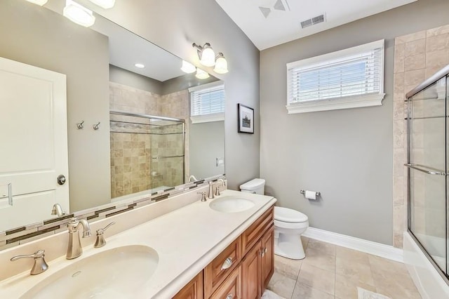 full bathroom with vanity, tile patterned floors, shower / bath combination with glass door, and toilet