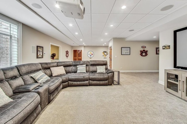 living room featuring a paneled ceiling and light carpet