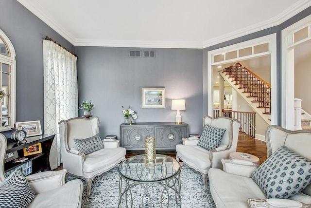 sitting room featuring hardwood / wood-style flooring and crown molding