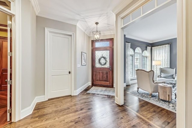 foyer featuring crown molding and wood-type flooring