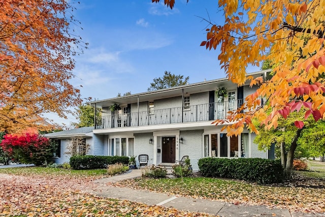 view of front of home with a balcony