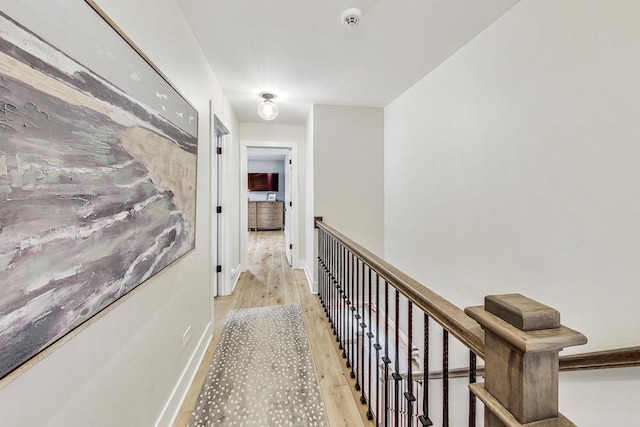 hall with light hardwood / wood-style floors