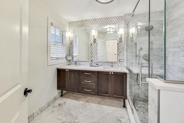 bathroom with vanity and a shower with shower door