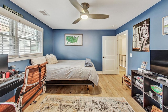 bedroom featuring ceiling fan and light hardwood / wood-style floors