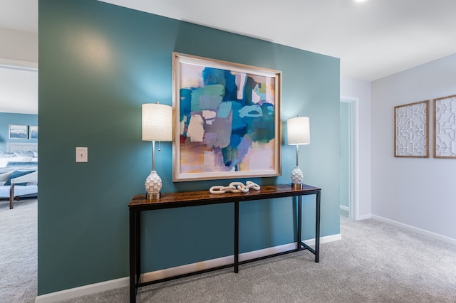 hallway with carpet flooring