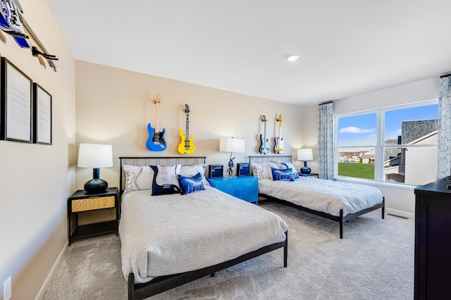 bedroom with light colored carpet