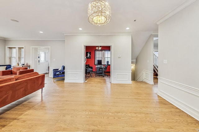 interior space with crown molding, a chandelier, and light hardwood / wood-style floors