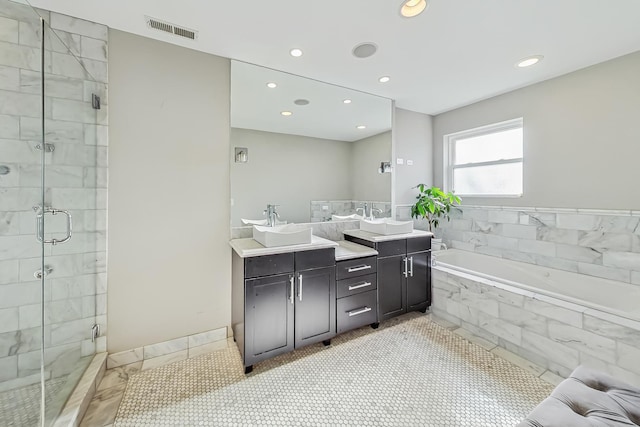 bathroom featuring vanity, separate shower and tub, and tile patterned flooring