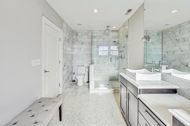 bathroom featuring vanity, an enclosed shower, and toilet